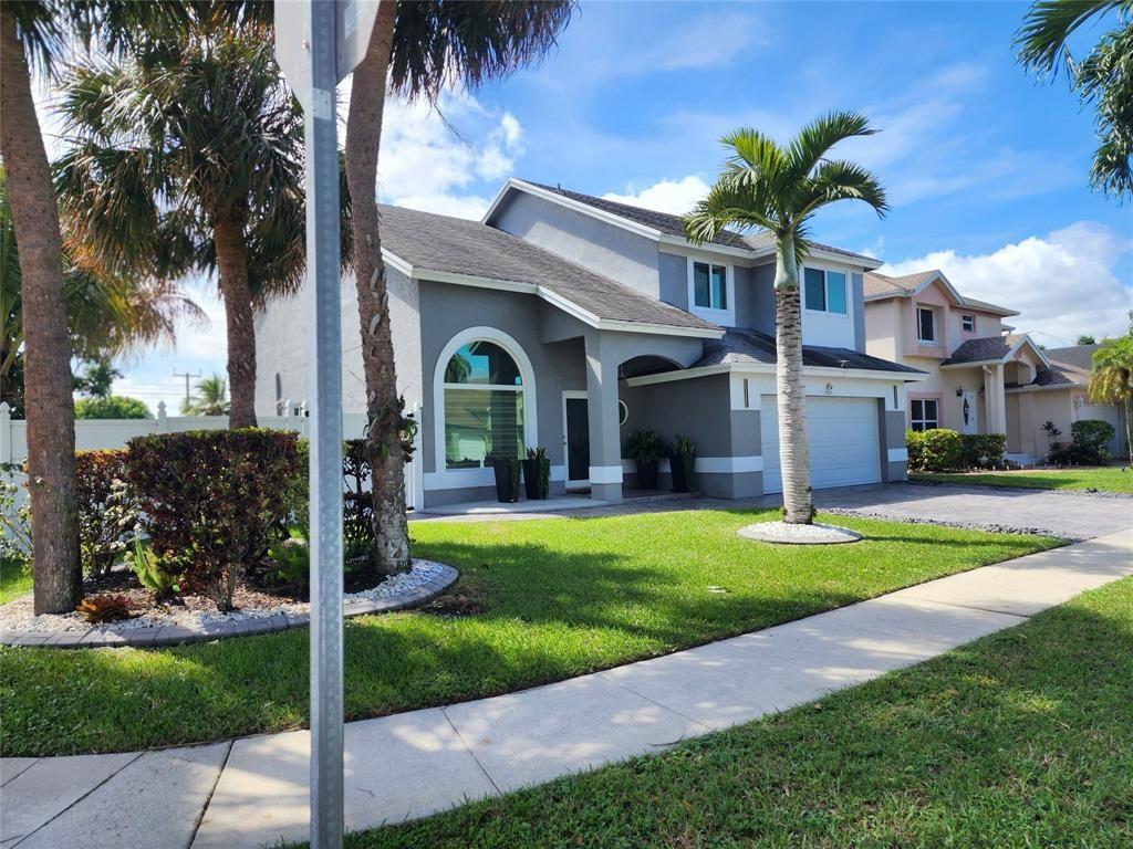 WOW!! This house is the one you have been looking for. It has it all! 4 Bedrooms, 2.5 Bathrooms, Two Car Garage, Corner Lot with Privacy fence. New Impact Windows & Doors, Updated Gorgeous Bathrooms. The Primary Bathroom has a Large Jacuzzi Tub Large Shower with Frameless Shower doors & beautiful Porcelain tiles. The Updated Kitchen features Quartz Countertops, Stainless Steel Appliance, beautiful white cabinets. The BACKYARD is Amazing!! The large fenced in Yard is Perfect for entertaining family & friends or for Relaxing under the beautiful Pergola watching the outdoor TV. In addition to the covered pergola there is also a beautiful deck, and fruit tree. Great Pembroke Pines location, nice community with friendly neighbors. Just 1st month & One Month Security deposit required!