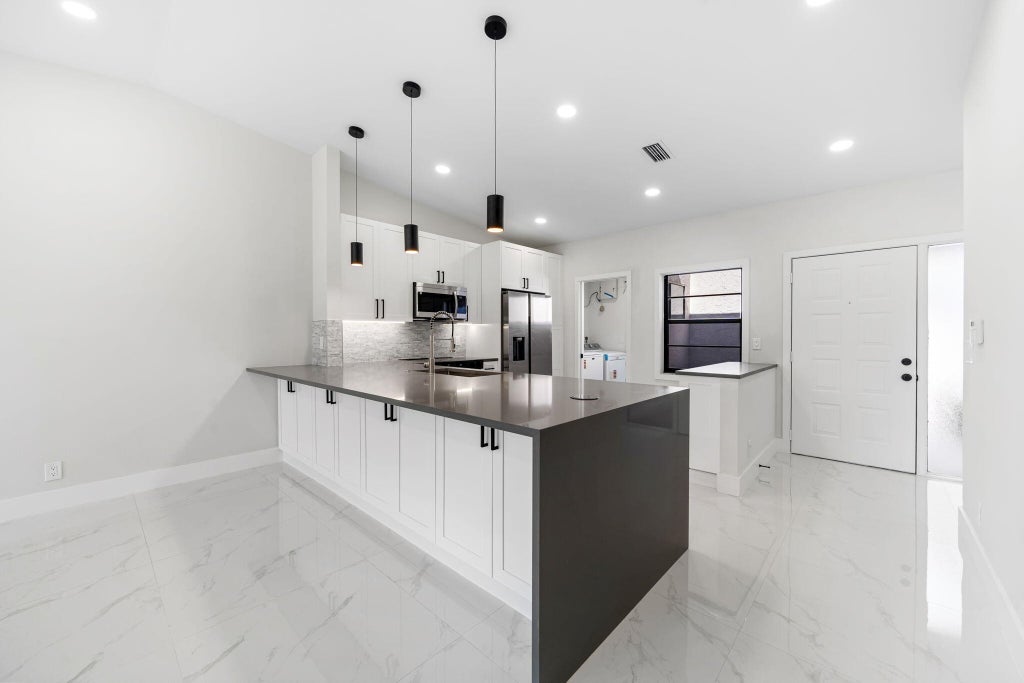 Photo of 6092 Kings Gate Circle, Delray Beach, FL 33484 (MLS # R11062979)