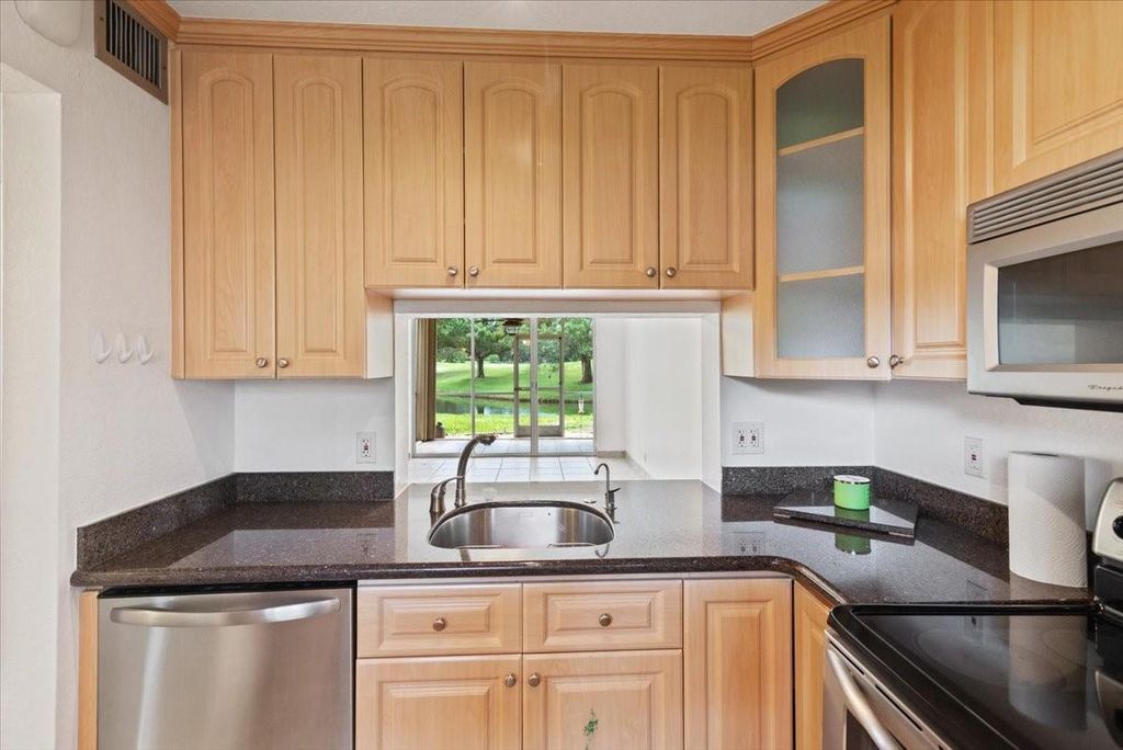 Photo of 9470 Poinciana Pl # 1-103, Davie, FL 33324 (MLS # F10532372)