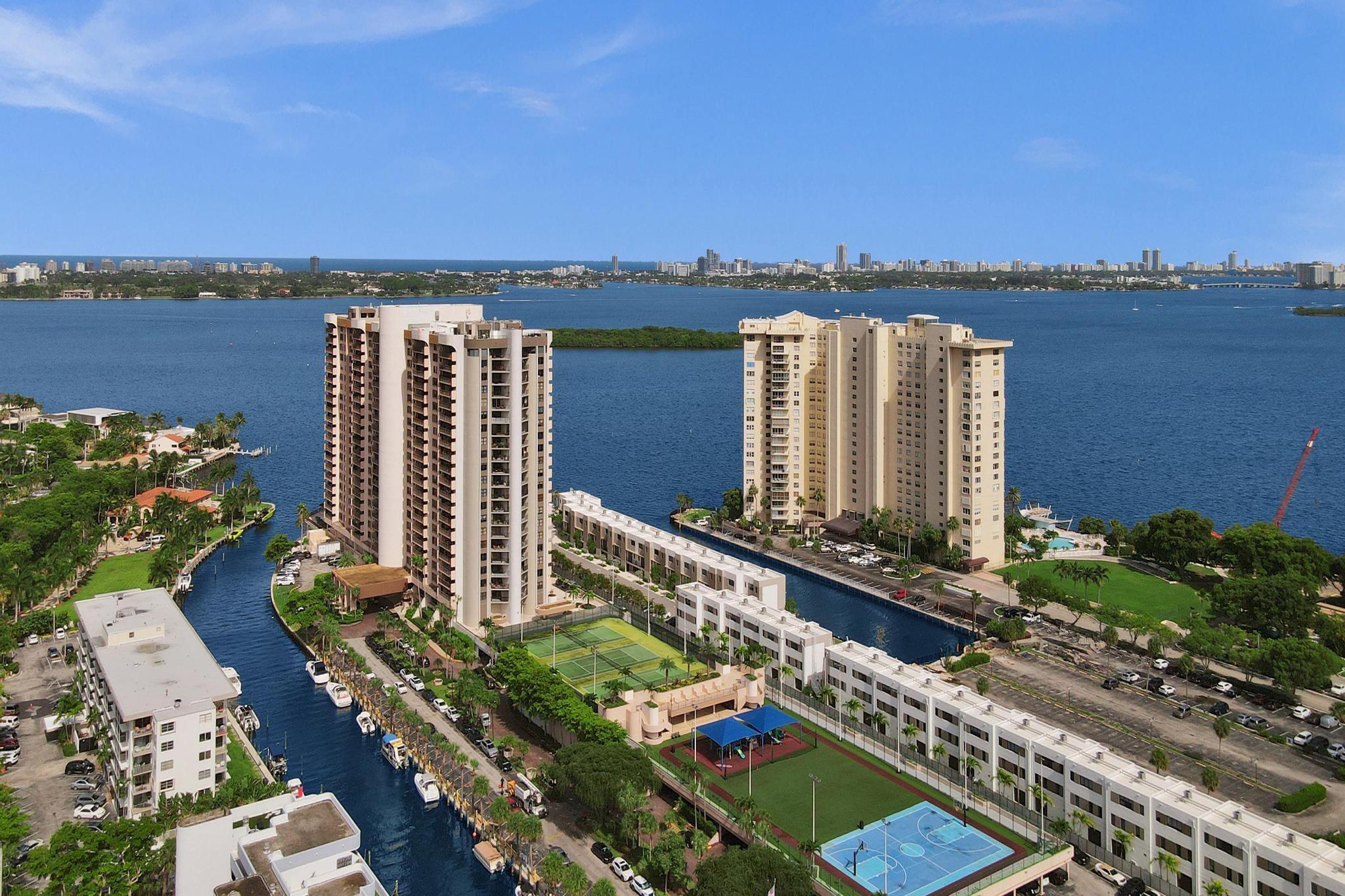 Welcome to Unit 703 at The Cricket Club. This spacious corner unit in the desirable 03 line features 2 bedrooms, 3 bathrooms, and over 2300 square feet with beautiful views of Biscayne Bay, the Miami skyline, and surrounding waterways. The open layout includes a large living area, formal dining, and a versatile den or office. The updated kitchen offers modern finishes, a large island, and plenty of storage. Two private balconies, including a rotunda terrace, provide great space for relaxing or entertaining. The primary suite has dual bathrooms and custom closets. Updated flooring, lighting, and tasteful finishes throughout create a move-in ready home. 24-hour concierge, valet, waterfront pool, fitness center, tennis and basketball courts, clubhouse, library, and boat docks.