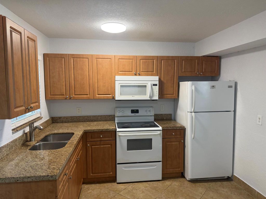 Photo of 221 10th Street, Lake Park, FL 33403 (MLS # R11126139)