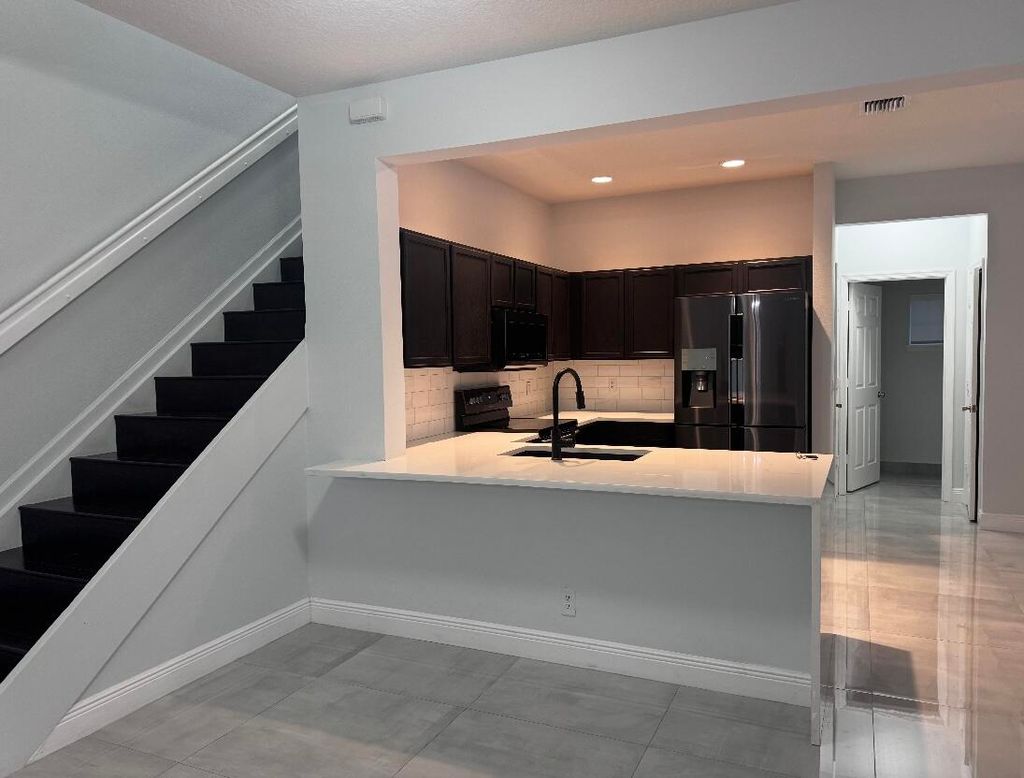 Photo of 1086 Woodfield Road, Greenacres, FL 33415 (MLS # B26021098)