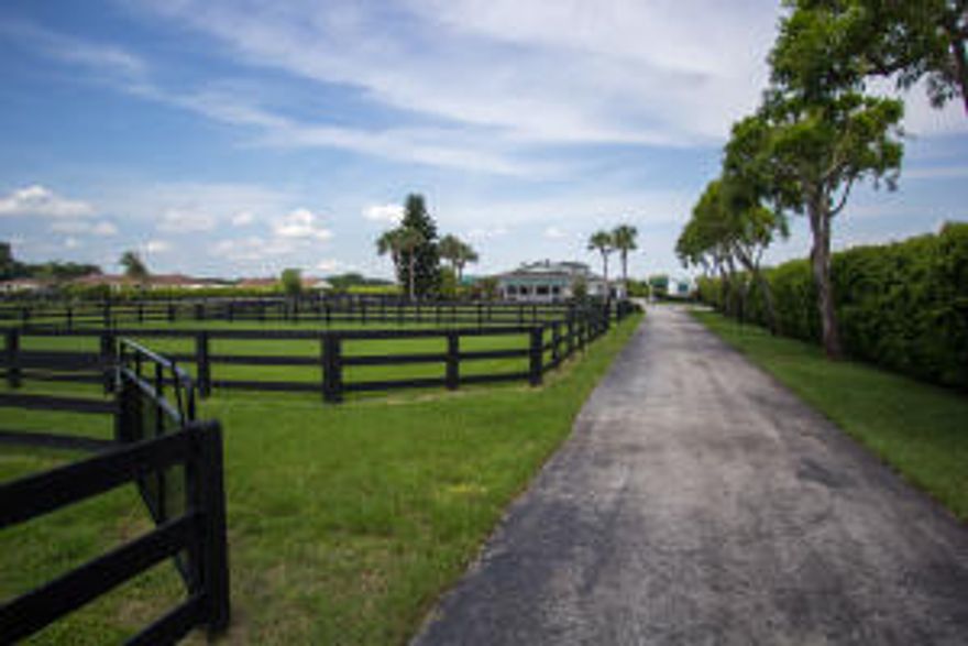 This beautiful 5+ acre property is perfectly situated adjacent to the Palm Beach Equine Clinic. Located within the lovely Southfields neighborhood, this barn is a quick hack to the Global Dressage Festival and the Winter Equestrian Festival. This facility is well-equipped with two, two bedroom, two bathroom apartments, three tack rooms, and three feed rooms. The grounds have 11 paddocks and a round pen. There are two barns on the property that contain a total of 38 stalls, providing plenty of space for all of your horses or to be utilized as rental stalls (great investment property potential).