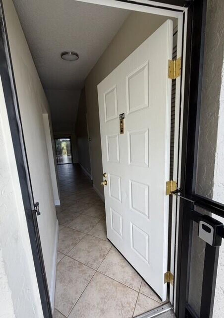 Beautiful all-ages condo in a prime central Boca Raton location, just 5 miles from the beach. This stunning second-floor unit offers 2 bedrooms and 2 bathrooms with a desirable split-bedroom floor plan and vaulted ceilings that create a bright, open feel. The updated kitchen features granite countertops, stainless steel appliances, and modern finishes, while tile flooring runs throughout the home for easy maintenance.The spacious primary bedroom includes a walk-in closet with custom built-ins, and the guest bedroom also offers built-in closet organization. Ideally located near Town Center Mall, top restaurants, parks, and houses of worship. Enjoy community amenities including a pool & a convenient car wash area. The low monthly association fee covers cable, water, internet & roof repairs