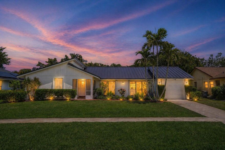 Come see this COMPLETELY REMODELED 2 bedroom PLUS OFFICE, 3 FULL BATH home w/ SOARING CATHEDRAL CEILINGS, NEW METAL ROOF (2026) and coastal style PORCELAIN TILE FLOORING THROUGHOUT!  The open concept floor plan gives a very light bright and open feeling w/ lots of NATURAL LIGHT streaming through.  The kitchen features, QUARTZ COUNTERTOPS & a 10 ft QUARTZ ISLAND (room for 6 barstools!)  The Primary bath features a white shaker vanity w/ QUARTZ countertop & the contemporary shower looks like right off HGTV.  The guest bath was also beautifully updated.  The BONUS OFFICE area features a cute gem of a FULL BATH too!  Relax on the brick paver patio to grill out w/ friends or catch some rays in your own very PRIVATE backyard!  Coco Wood Lakes is a quiet 55+ community in the heart of Delray!