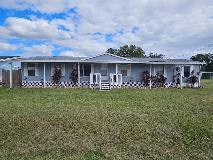 Treasure Island~Discover this turn-key 3 bedroom, 2 bathroom manufactured home perfectly set on the water with two dock spaces, ideal for boating and enjoying Lake Okeechobee living. Located in a high and dry area with no HOA, this property offers freedom and convenience with an easy commute and close proximity to local amenities.The home features vinyl flooring throughout, an open and comfortable layout, and a fenced patio perfect for relaxing or entertaining. Major updates include a new 3.5-ton A/C unit installed 4/2025 and a new water heater installed 2/2024. Property is serviced by city water and septic. Move-in ready and wonderfully located--enjoy waterfront living with comfort and ease!