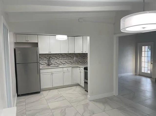 Lovely 3 Bedroom, 2 Bathroom apartment Just a Hop Skip & Jump away from Wilton Drive! Spacious and Updated 3/2 in a duplex located in the Heart of Wilton Manors. Big Beautiful kitchen, dining and living room. Impact windows, private full laundry facility - no coins. Landscaped, private fenced in yard. Move in money based on credit and pre-paid $150 cleaning fee due to move in. $75 Application Fee. Pets welcome with a $250 Non-Refundable fee. Speedy Approval. Make this your new home!!!