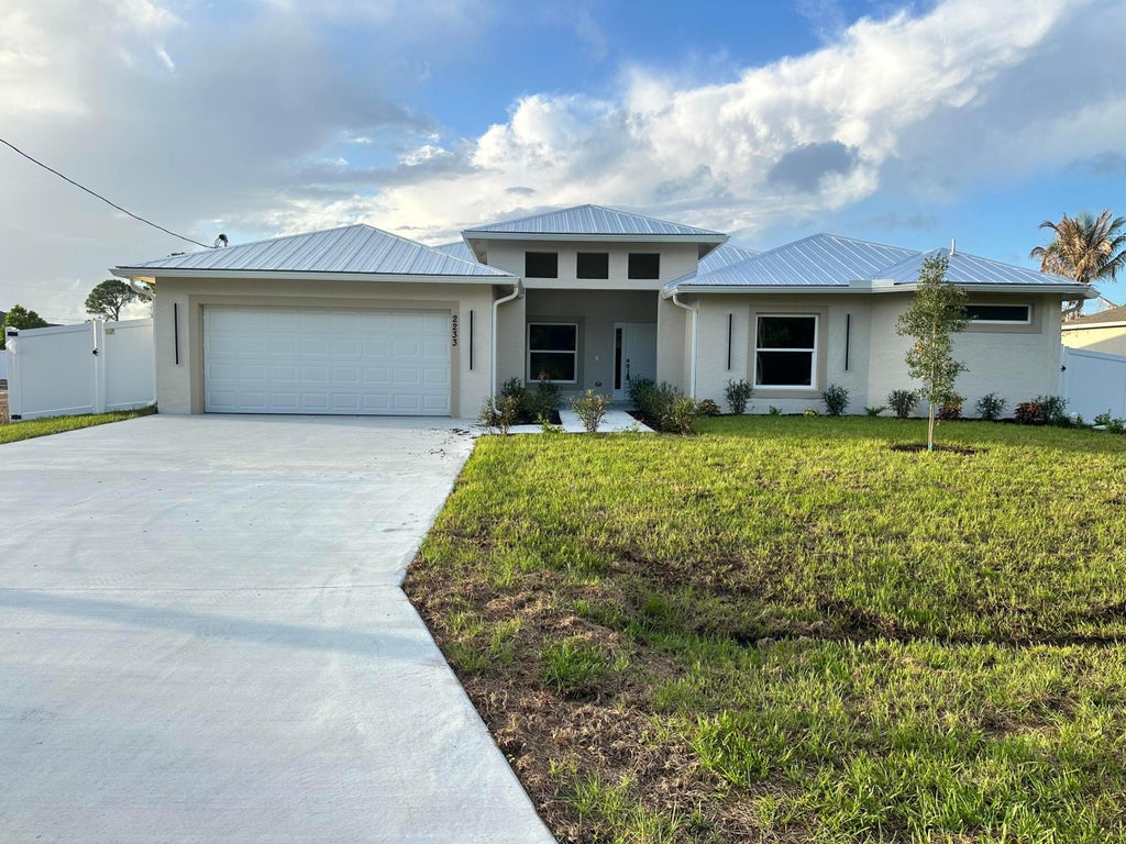 Photo of 2233 SW Elmwood Avenue, Port Saint Lucie, FL 34953 (MLS # B26030077)