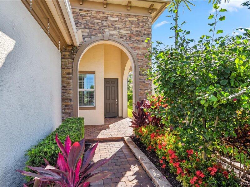 Beautifully maintained 2BR + den, 2BA home located in the gated community of PGA Verano. This open floor plan features tile flooring throughout main living areas, high ceilings and abundant natural light. The kitchen offers quartz countertops, stainless steel appliances, and a large island - perfect for entertaining. Spacious primary suite includes walk in closet, dual vanities, and a walk-in shower. Enjoy outdoor living on the extended screen lanai with a private backyard view. Additional features include impact glass, 2 car garage and energy efficient construction. Resort-style amenities include clubhouse, indoor/outdoor pools, fitness center, tennis, pickleball and a full social calendar. Convenient to I-95, shopping, dining and golf.