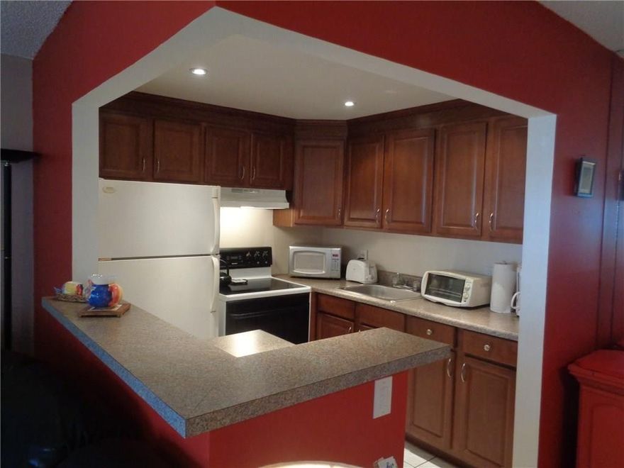 1ST FLOOR, 1/1.5, TURNKEY FURNISHED CONDO WITH OUTDOOR PATIO ON QUIET CUL-DE-SAC! Open updated kitchen with recessed lighting, newer cabinets, laminate counters and appliances (dome removed).  Tiled throughout.  2 a/c's (LR 2016), updated bathrooms, enclosed patio and back door to outdoor patio on serene canal view.  BBQ permitted outside.  Rentable after 1 year of ownership.