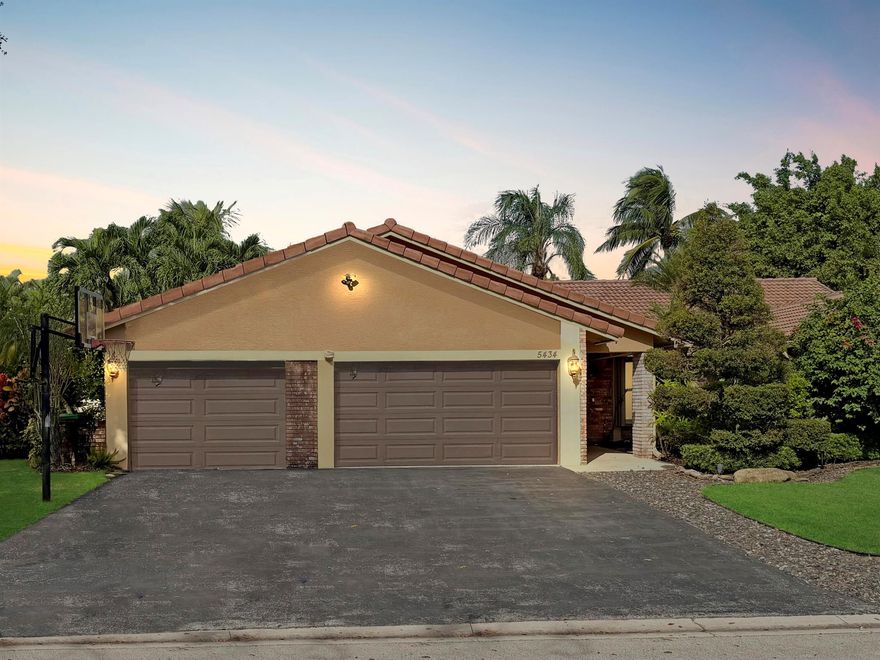 Welcome home to this beautiful 4 bed/2.5 bath pool home on a quiet, tree-lined street in one of Coral Springs' most desirable low HOA, non-gated communities: Pine Ridge. The open-concept layout features vaulted ceilings, a spacious family room with gorgeous stone accent wall and electric fireplace, and a chef's dream kitchen with high-end appliances, granite counters, dual ovens, induction cooktop, wine fridge, and a large island and bar for gathering. Bedrooms are conveniently arranged on one side, maximizing living space.Step outside to your ultimate private tropical retreat with sparkling freeform pool, pergola, fire pit,and multiple lounge areas surrounded by lush landscaping. Fully fenced and a 3-car garage to provide plenty of parking.This is the one you've been waiting for!