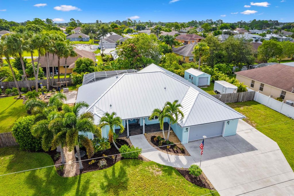 Photo of 3615 SW Vollmer Street, Port Saint Lucie, FL 34953 (MLS # R11004982)