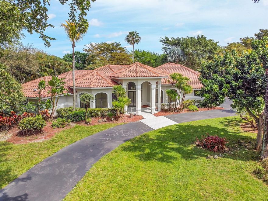 Enjoy refined living in this exquisite 5-bed, 4-bath estate on an expansive 45k sqft lot in the exclusive gated community of Whispering Woods. Completely remodeled with impeccable attention to detail, this stunning home seamlessly blends elegance, comfort, and modern sophistication. Generous living spaces flow effortlessly to a spacious outdoor entertainment area, ideal for hosting upscale gatherings or enjoying serene, private evenings. Perfectly located near premier restaurants, upscale shopping, vibrant nightlife, and more, with convenient access to the Sawgrass Expy and Turnpike. This is a rare opportunity to own a truly gorgeous, move-in-ready home on an oversized lot in one of the area’s most desirable neighborhoods. Impact windows & doors throughout. A must-see luxury residence. Property currently staged.