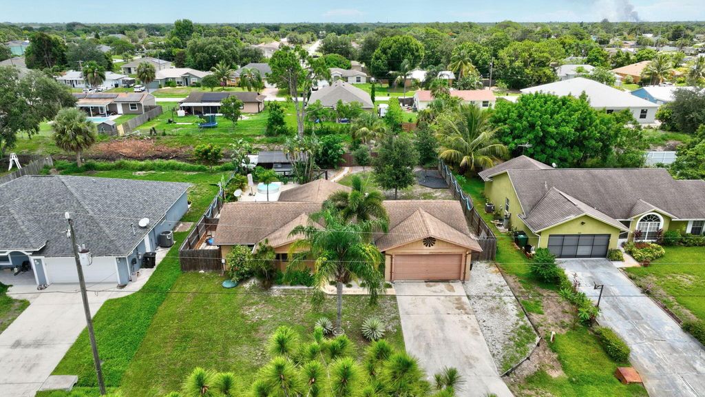 Photo of 2041 SW Susset Lane, Port Saint Lucie, FL 34953 (MLS # R11000029)