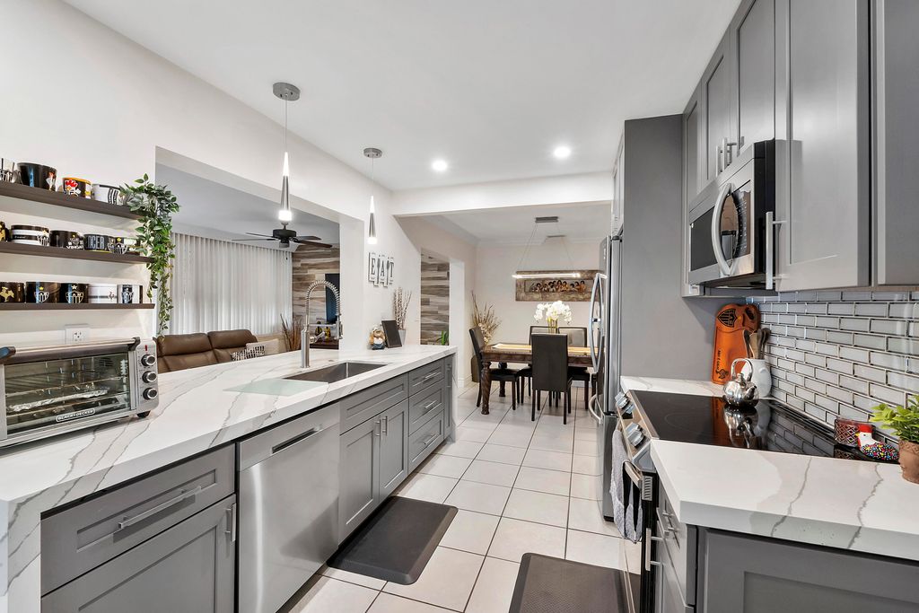 Photo of 5020 SW 11th Cir, Margate, FL 33068 (MLS # B26000800)