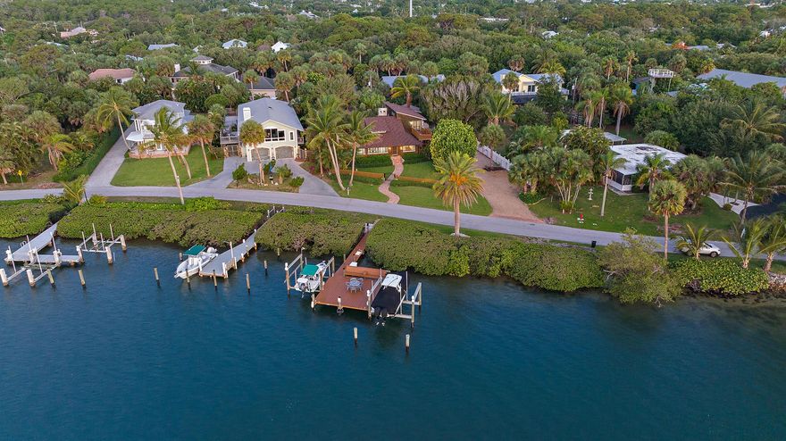 Experience unparalleled waterfront living with this stunning 6-bedroom, 6.5-bathroom Intracoastal estate, perfectly designed for both luxury and functionality. Ideal for boaters, the property features deep water access, a large dock, and a boat lift. This fully furnished home boasts spacious ensuite bedrooms, an elevator, a full-house generator, and impact glass throughout. Both levels are designed with independent living in mind: the upper level offers the main living area with a gourmet kitchen, expansive living and dining spaces with a cozy fireplace, three bedrooms, and an impressive deck for entertaining with breathtaking views of Jupiter Island.
