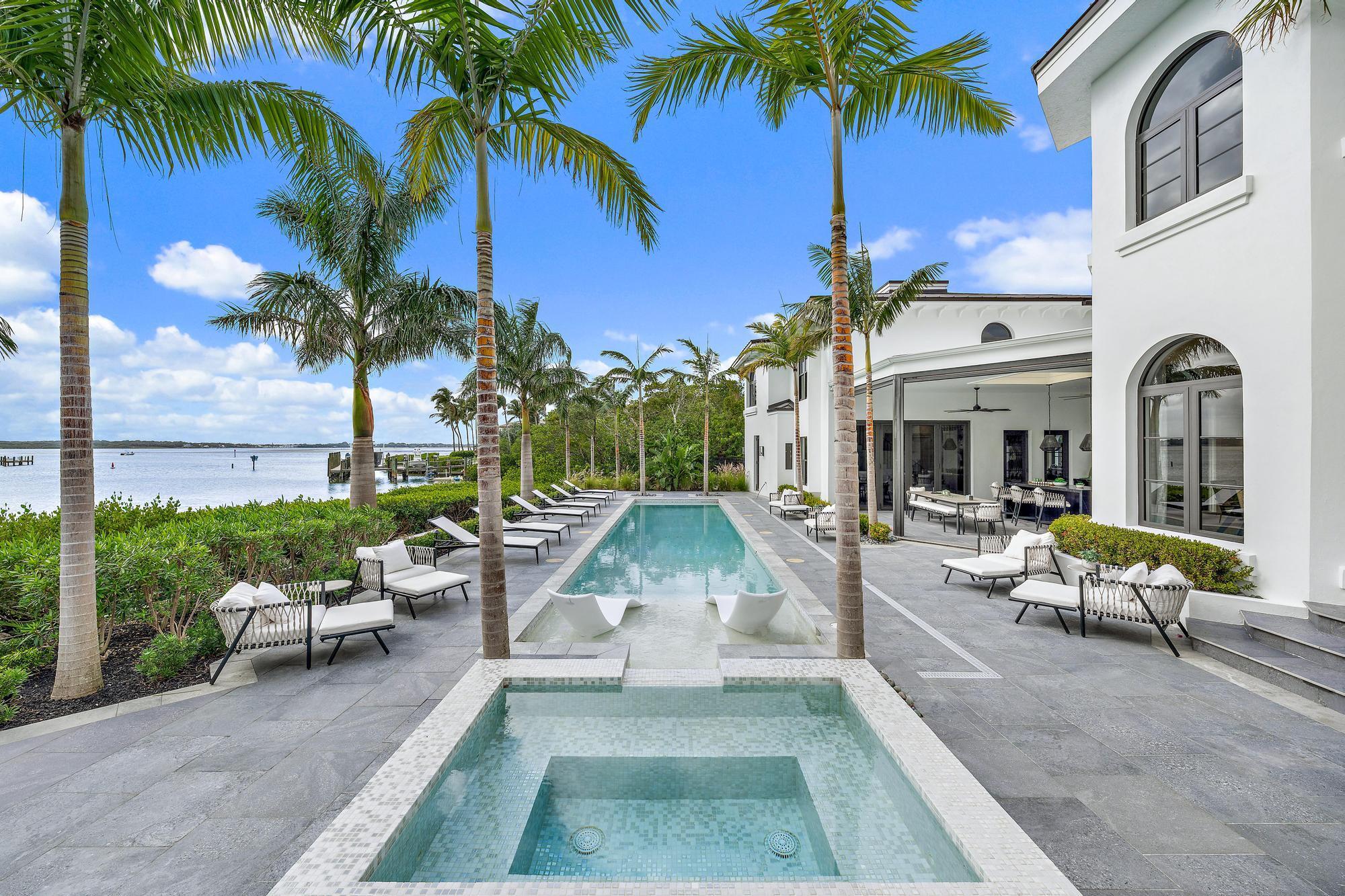 One of the most expansive Waterfront Estates in Stuart's most sought after address. This waterfront estate is located on a secluded barrier island, nestled in the prestigious Sailfish Point Country Club. Surrounded by the turquoise waters of the Atlantic Ocean and Indian River, this nearly 9,000 sq. ft. masterpiece redefines luxury. Completed in Fall 2023, this home has been honored with Florida Design Magazine's Seaglass Awards in five categories, showcasing superior craftsmanship and attention to detail. The home's 270 feet of pristine waterfront and a state-of-the-art dock cater to the most discerning yachtsman, offering direct access to the ocean's endless horizons.