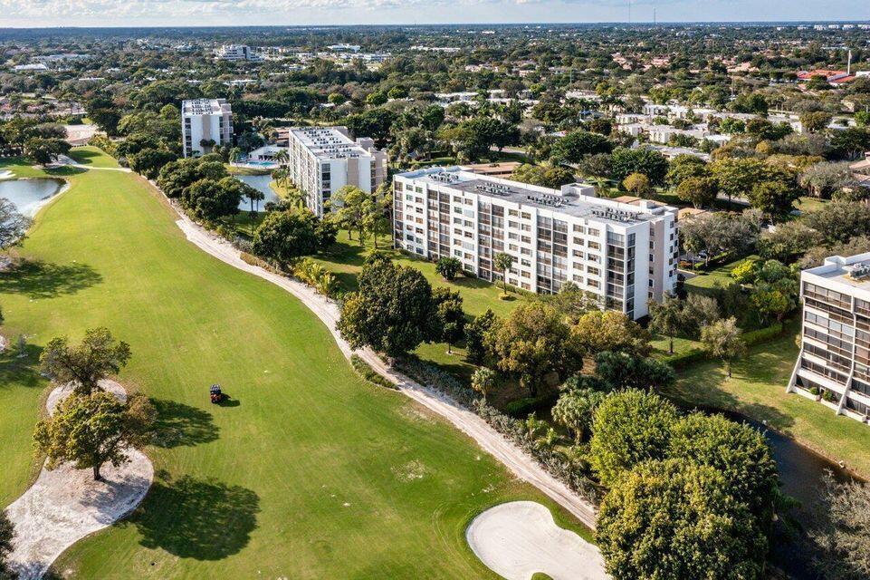 Rarely available, southeast corner penthouse in this beautiful Central Boca community. Amazing golf course, lake and skyline views! Lush tropical setting! No golf membership purchase required. Corner balcony provides fantastic breezes! Newer cabinetry and countertops. Tile floors throughout, with bamboo wood floors in master bedroom. Bedroom 3 is the perfect office or den (but has a closet and is a bedroom). Club Royale is among the best of central Boca. All 168 homes have beautiful views with Southern exposure. Every home has covered parking and a separate storage room. Lakefront clubhouse with pool, hot tub and outstanding view. Move fast on this one!