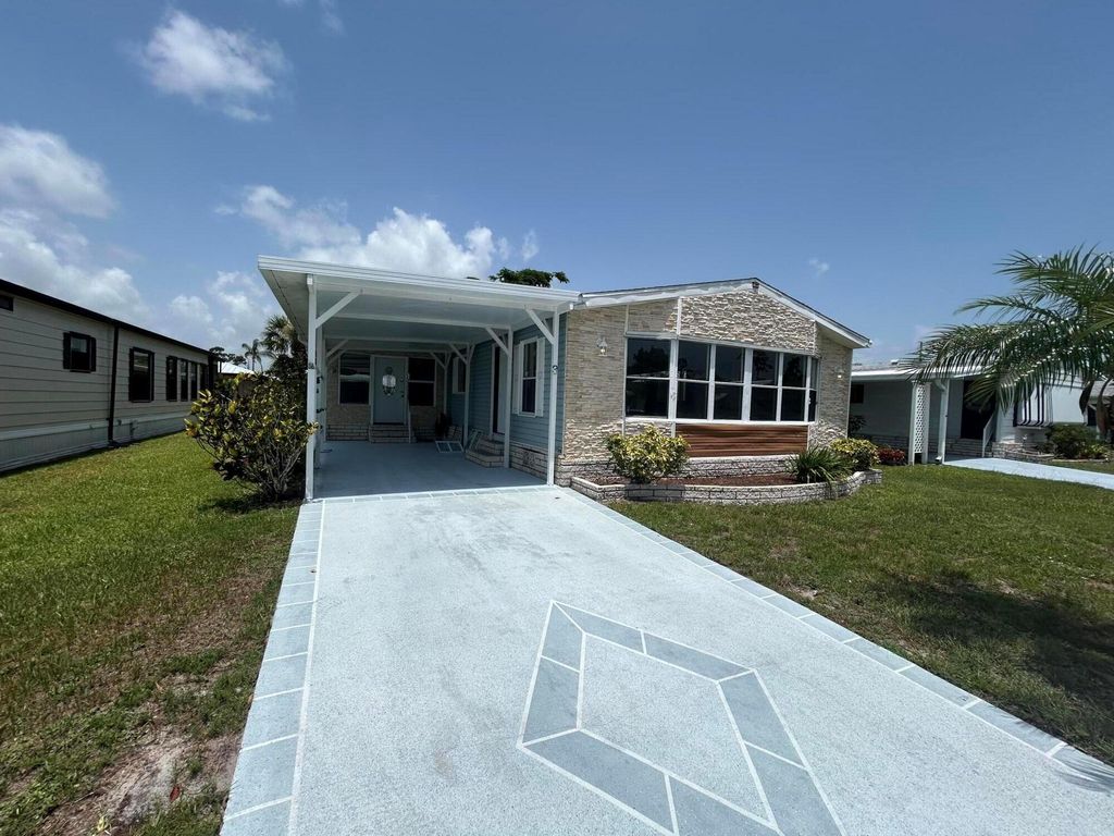 Photo of 3 Flores Del Norte, Fort Pierce, FL 34951 (MLS # R11104817)