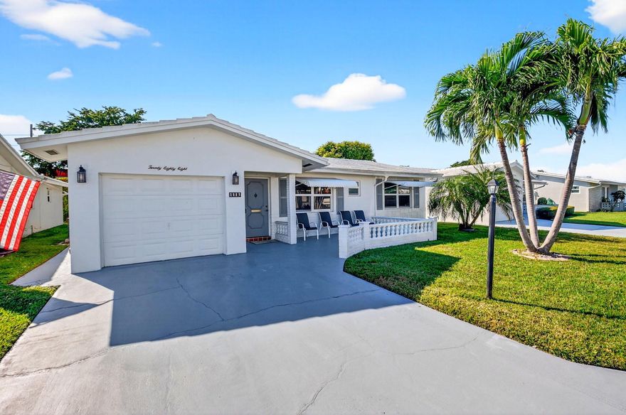 Welcome to Palm Beach Leisureville, a 55+ community! This inviting 1-story waterfront home offers 2 bedrooms, 2 bathrooms, and an entry-level living area designed for easy, low-maintenance living. Enjoy tranquil canal views from both the covered and open patio areas. The kitchen features granite countertops, stainless steel appliances, wood cabinets, and a pantry. Inside, tile flooring runs throughout the spacious living areas. The indoor laundry space--with tub, washer, and dryer--is conveniently located in the 1-car garage. Additional highlights include impact windows, an impact garage door & an accordion shutter for the rear sliders. AC 2019, HOA $195/month, and the recreational lease is paid in full. This home offers a peaceful retreat while keeping you close to all community amenities