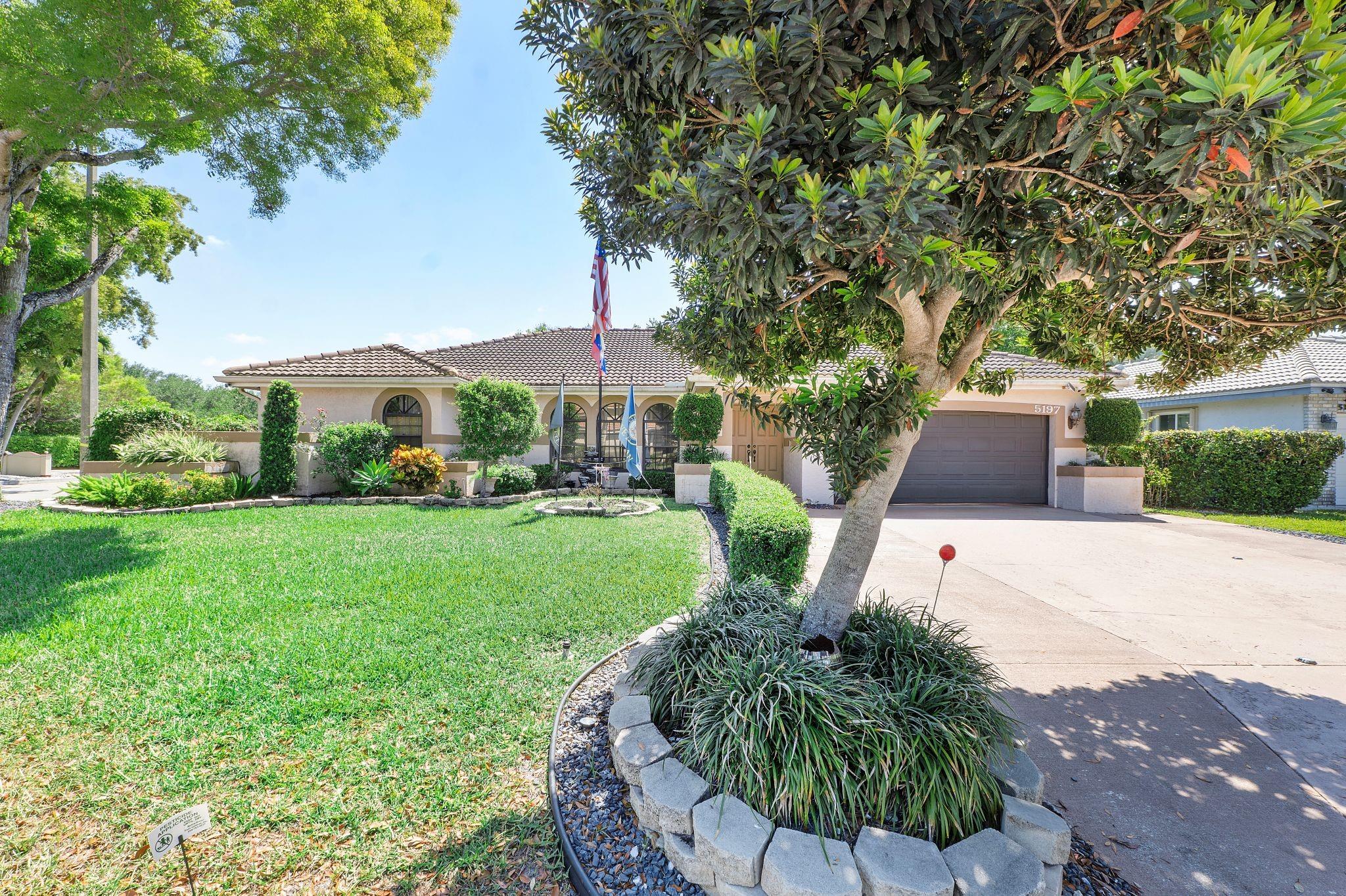 This stunning property features an expanded driveway, 4 spacious bedrooms and 3 modern bathrooms, all adorned with stylish laminate floors. The updated kitchen is a chef's delight, offering quartz countertops, a generous center cooking island, sleek white shaker cabinets, and stainless steel appliances. Soft water system. An expansive primary bedroom with updated bathroom and his and her vanities. The additional suite is perfect for guests or family. Step outside to your private oasis with a sparkling saltwater pool and spa, a covered patio that boasts a bar, grill, sink, and refrigerator for effortless entertaining. Enjoy the beauty of nature in the backyard, complete with a greenhouse and fruitful trees. SELLER PUT OVER $40,000 IN UPGRADES. LOW HOA!