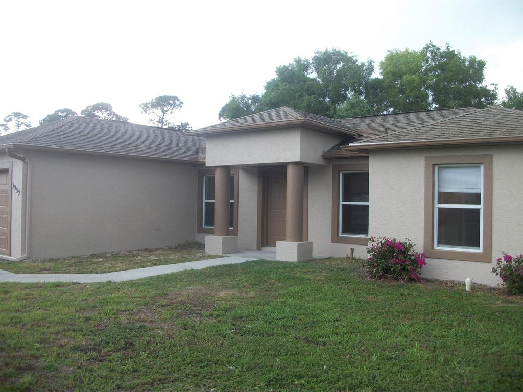 Photo of 1952 SW Hickock Ter, Port Saint Lucie, FL 34953 (MLS # R11010988)