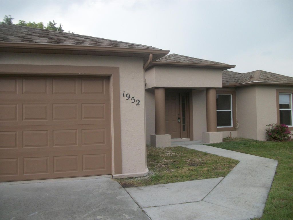 Photo of 1952 SW Hickock Ter, Port Saint Lucie, FL 34953 (MLS # R11010988)
