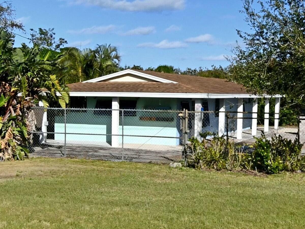 Prime commercial property available on US Highway 1 in Ft. Pierce on .46 acres including 40 Ft of frontage for high visibility with heavy daily vehicle traffic. Building is approx. 800 sq ft with plenty of office space which Includes 1 Interior bathroom + 2 exterior bathrooms there is also a huge outdoor covered patio. This commercial property is ideal for various business types including construction, landscaping, real estate office, insurance office, auto/boat/motorcycle dealership plus much more! This property is fully fenced for added safety. Property is on well/septic systems. There is also ample exterior storage and parking with potential to expand.Don't miss this opportunity to invest in a versatile commercial property in a prime location!