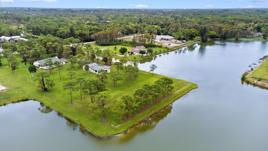 SPECTACULAR PANORAMIC LAKE VIEWS, 5 ACRE ONE OF A KIND EQUESTRIAN WATERFRONT POINT PROPERTY, REMODLED 4 BEDROOM 2 BATH, FAMILY ROOM WITH FIREPLACE. OPEN ISLAND GOURMET KITCHEN, SNACK BAR, BREAKFAST AREA,FORMAL DINING & LIVING ROOM. TILE FLOORS WITH HARDWOOD DESIGN, RELAX & ENJOY THE GORGEOUS SUNSETS FROM ROOFED PATIO & POOL AREA, 2 CAR GARAGE.  4 STALL ISLE BARN WITH TACK & FEED ROOMS, A SEPERATE BLDG FOR CAR, BOAT OR RECREATIONAL VEHICALS, OR COULD CONVERT INTO AN ADDITIONAL BARN  . GUARD GATED EQUESTRIAN COMMUNITY WITH MILES OF RIDING TRAILS. CONVENIENTLY  LOCATED TO ALL OF WELLINGTONS EQUESTRIAN EVENTS, SHOW GROUNDS & POLO. EASY ACCESS TO  TURNPIKE, HOSPITALS, WELLINGTON MALL & SCHOOLS. THE ADJACENT PROPERTY IS FOR SALE 8 BEDROOM 6 1/2 BATH, 6 CAR GARAGE, POOL , TOTAL 12,309 SQ FT.