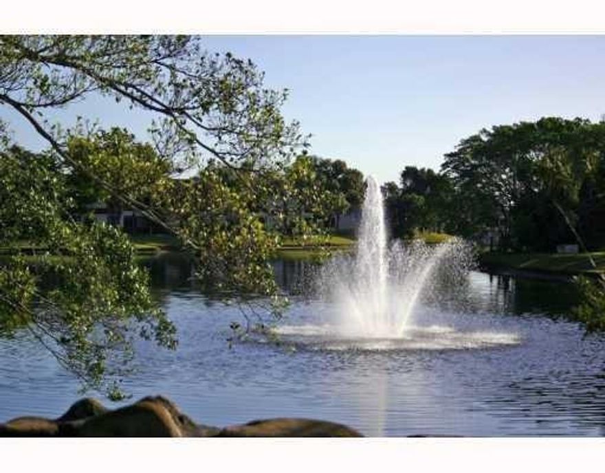 Spacious apartment in highly desirable neighborhood. 2 bedrooms, 2 bathroom, large covered Screened Balcony with amazing lake view. Unit has a storage unit too. Beautiful view of water, trees, ducks too. The community offers swimming pool, tot lot, tennis courts, and a clubhouse. Grounds are well maintained with lush with greenery, walking paths and lakes. Great location just north of Broward Blvd and east of University Drive. Near restaurants,shopping, schools,etc.  Home is being sold in as-is condition,needs updating. Purchase at this low price and then make it your own! OK to lease right away.