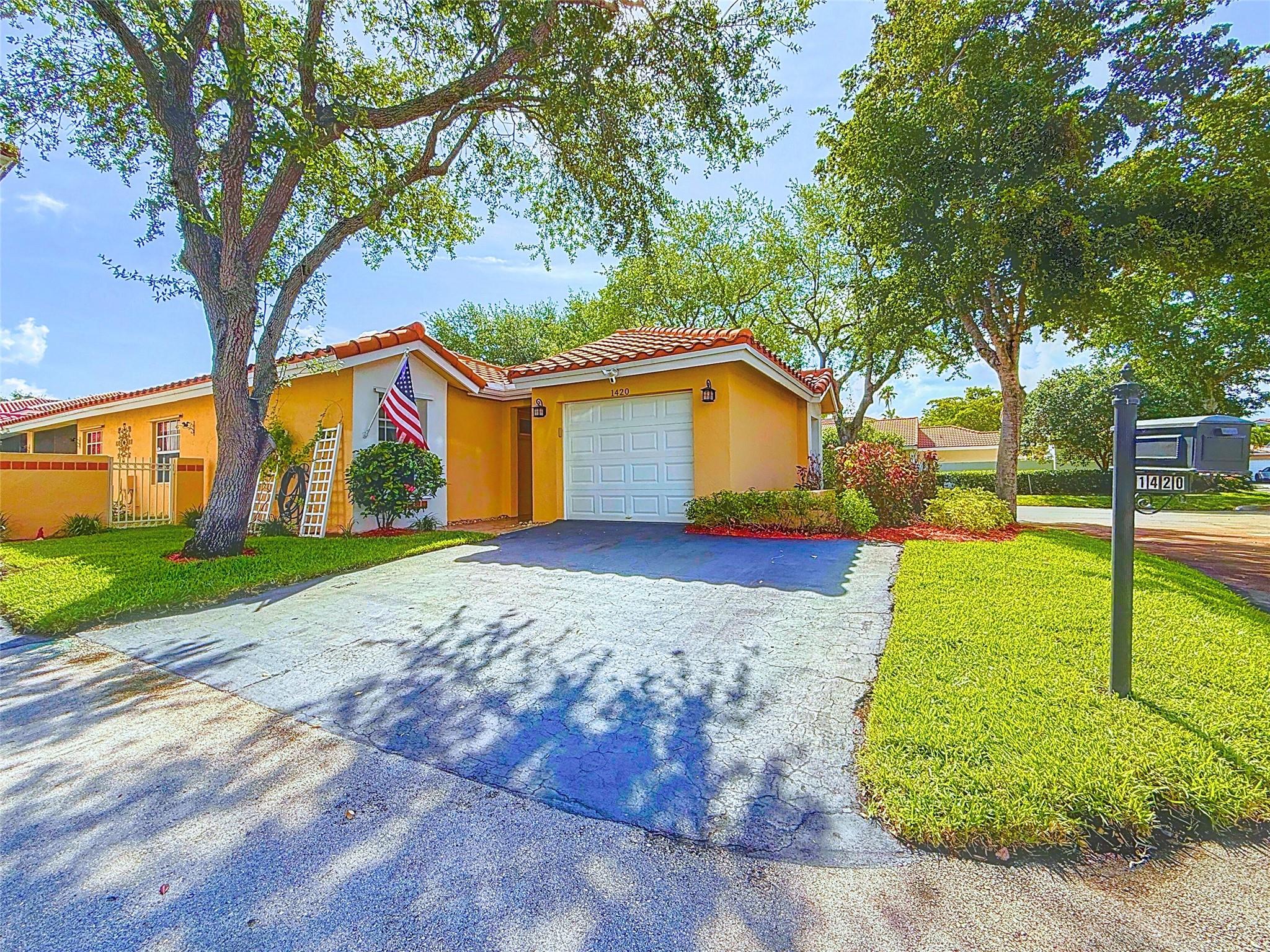 Welcome to your new home! A beautifully maintained 3BR, 2BA home in Weston’s desirable Country Isles Garden Homes. Located on a quiet cul-de-sac, this single-story gem features vaulted ceilings, bay windows, and abundant natural light. Enjoy tile and luxury flooring throughout, an updated kitchen with wood cabinets, modern counters, and stainless steel appliances. Both bathrooms are tastefully remodeled. Relax on the screened patio or in the fenced backyard—ideal for kids, or entertaining. Additional highlights include a newer roof, A/C, and water heater. Minutes to Weston Town Center, top-rated A+ schools, parks, dining, and major highways.