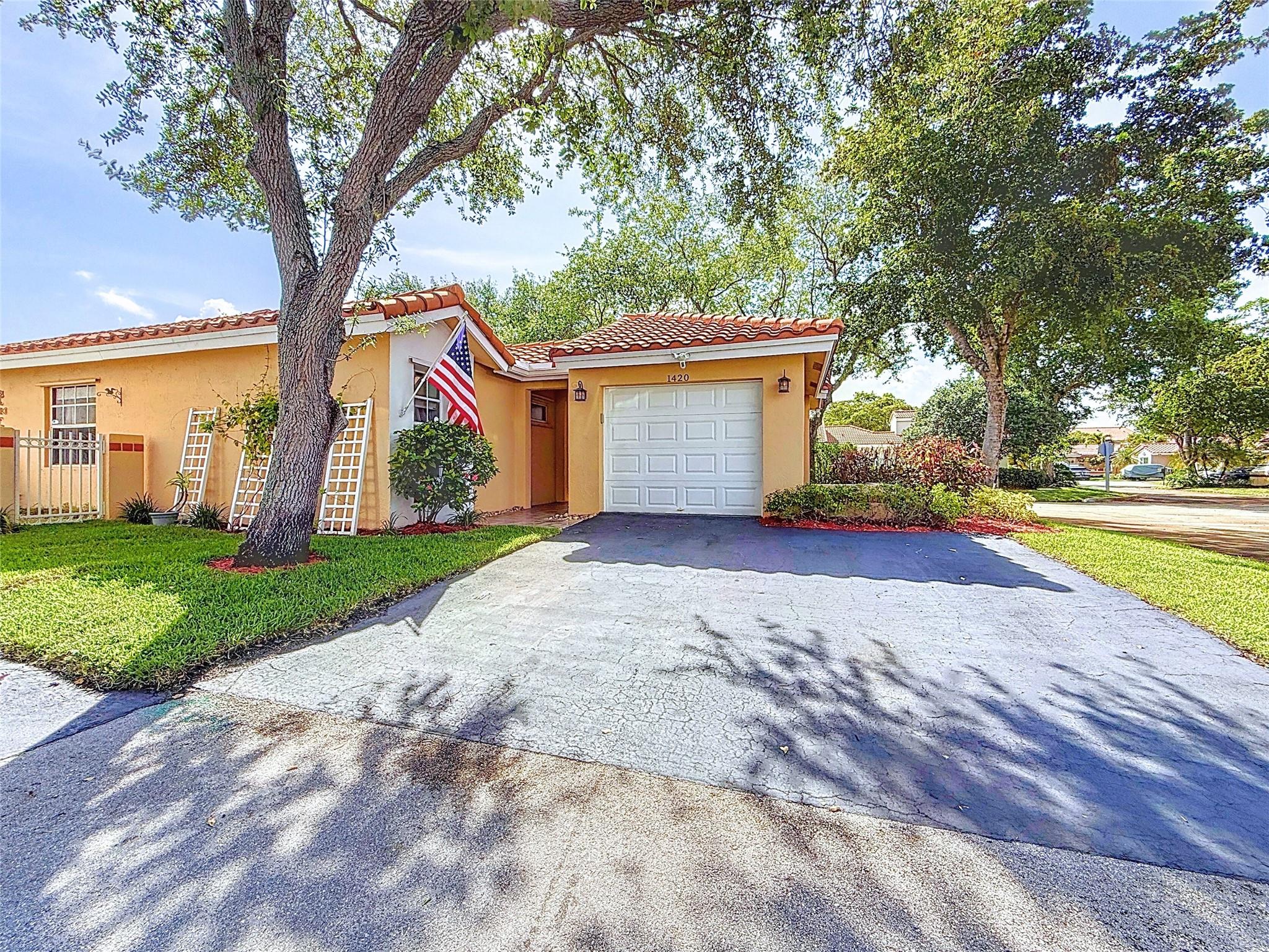 Welcome to your new home! A beautifully maintained 3BR, 2BA home in Weston’s desirable Country Isles Garden Homes. Located on a quiet cul-de-sac, this single-story gem features vaulted ceilings, bay windows, and abundant natural light. Enjoy tile and luxury flooring throughout, an updated kitchen with wood cabinets, modern counters, and stainless steel appliances. Both bathrooms are tastefully remodeled. Relax on the screened patio or in the fenced backyard—ideal for kids, or entertaining. Additional highlights include a newer roof, A/C, and water heater. Minutes to Weston Town Center, top-rated A+ schools, parks, dining, and major highways.