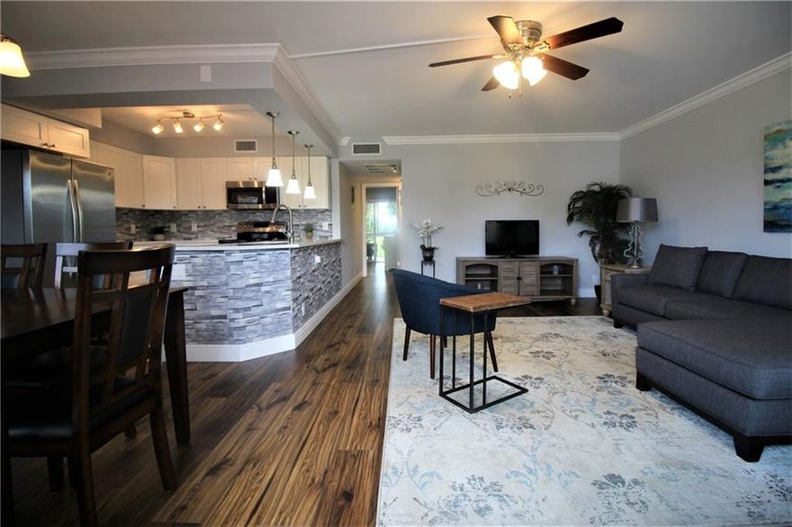 STUNNING LUXURY CONDO IN THE COVETED LYNDHURST AREA! TASTEFULLY REMODELED W/AN OPEN KITCHEN FEATURING WHITE CAB & QUARTZ COUNTERTOPS, SS APPL & WATER FILTRATION SYS!  SMOOTH WALLS & CEILINGS, CROWN MOLDING & HI-GRADE WOOD LAM FLRS THRU-OUT! UPGRADED HURRICANE IMPACT WINDOWS,FRONT DR & PATIO ENCL! UPGRADED ELECT PANEL,ALL NEW PLUMBING,NEW REMOTE CEILING FANS,NEW LT FIXTURES & MODERN BTHRMS. ENJOY YOUR MORNING COFFEE ON THE FULLY ENCL. AIR-CONDITIONED PATIO W/FLR TO CEILING MOTORIZED BLINDS OVERLOOKING A RELAXING PARK-VIEW SETTING!  WELL MAINTAINED BLDG.W/FIRE ALARM SYSTEM, GOOD RESERVES & 40 YR INSP! SHORT WALK TO THE POOL & CLUBHOUSE! COME ENJOY THE ACTIVE LIFESTYLE IN CENTURY VILLAGE W/24 HR SEC, FREE BUS SERVICE, POOLS, TENNIS, LAVISH CLUBHOUSE W/TONS OF AMENITIES!DON'T MISS THIS BEAUTY!