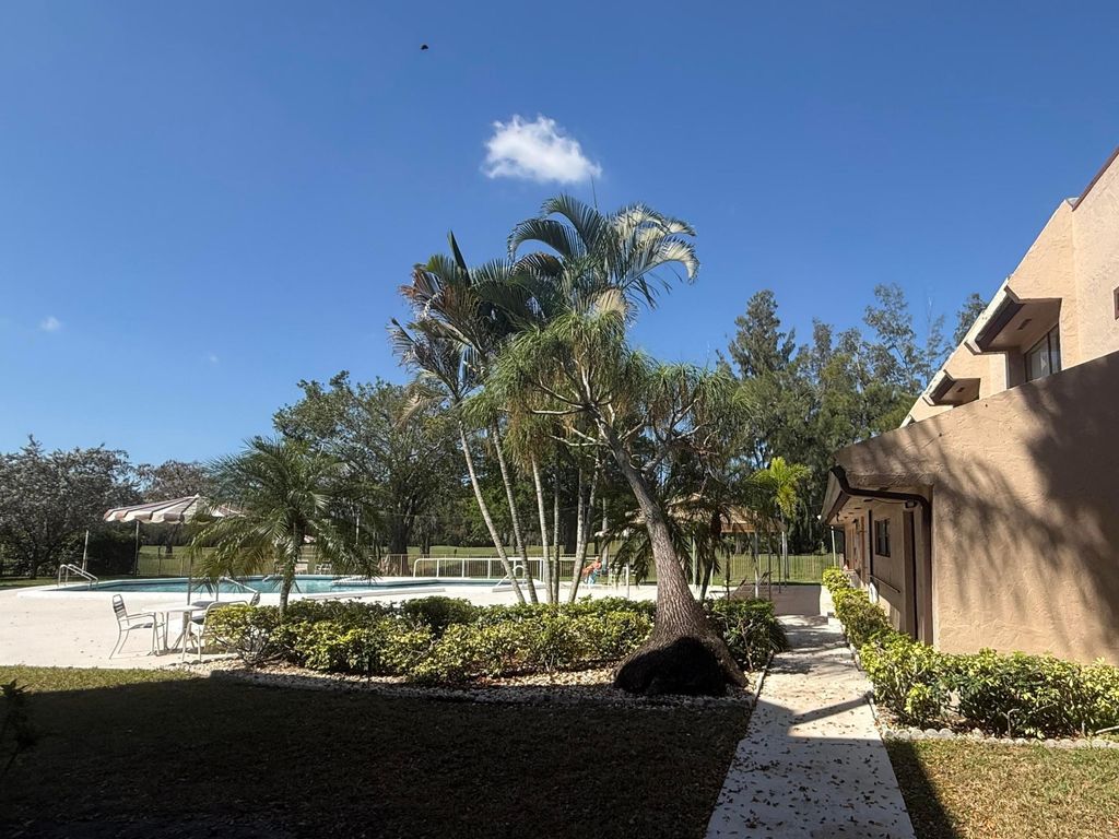 Photo of 7850 W Mcnab Road #210, Tamarac, FL 33321 (MLS # B26004569)