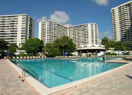 Highly DESIREABLE/Sought AFTER 14-LINE CORNER Apt in Luxurious FULL AMENITY Olympus Condo situated in the Exclusive 3 Island area in Hallandale located right on the Intracoastal. The Unit requires updating but with your personal touch and incredible views ..... Full 2 Bed 2 Bath CORNER UNIT providing 1580 sq ft of Liv Area (largest in the Bldg) with COMPLETE Amenity package incl- 24 Hr Manned Security, Valet, Olympic Size pools, Marina Boat Docks, State of the art Fitness/Gym, Yoga Studio, Sauna, Tennis (5 Courts,) Courtesy Shuttle Bus, Billiards, Business Center, Veh Car Wash, BBQ, Self service Cafe, Extra Storage, Clubhouse, Assigned COVERED Parking ..walking distance to Beach/Ocean, Yes to Pets (Emotional Support w/Letter) and can be leased immediately after closing. HOA is $1027/month