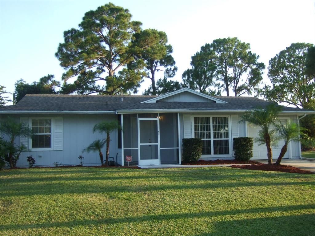 Photo of 1322 SW Crest Avenue, Port Saint Lucie, FL 34953 (MLS # R10703264)