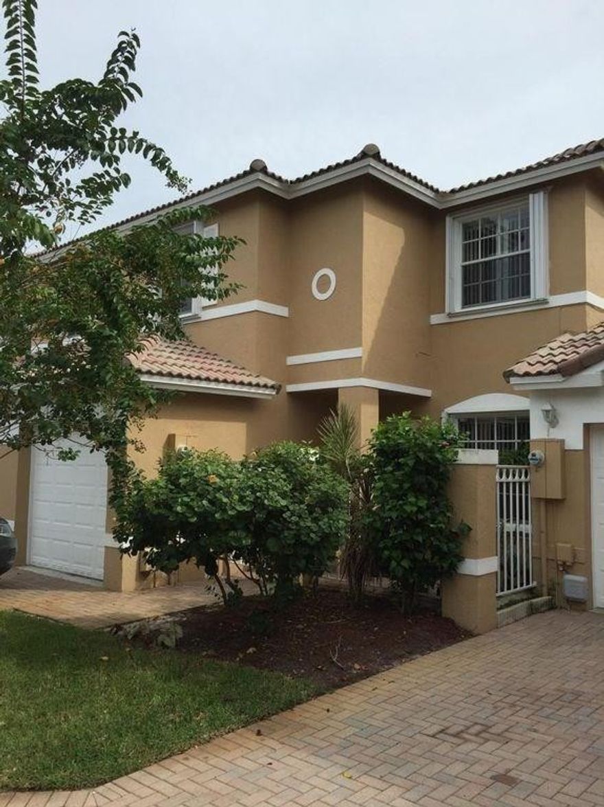 Beautiful townhouse in desired Waterfort Crossings. Three large bedrooms upstairs 1 large TV/ family room downstairs. The house has wood laminate floors throughout. Fenced back patio. It also has accordion hurricane shutters. Great community with A+ rated schools, close to Sawgrass Mills Mall and Highways. Very low HOA fees for the area.