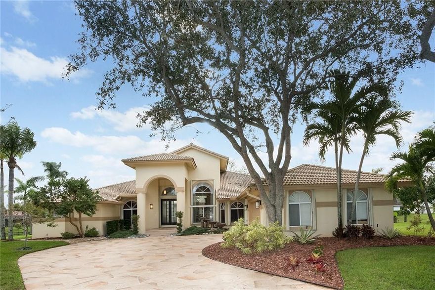 Stunning waterfront pool/spa home with exquisite custom detailing and upgrades:Thermador Range & Induction Cooktop, GE Monogram Sub Zero Refrigerator, Indoor Water Feature, Chilled Wine Keeper, Wine Refrigerator, Granite Countertops, Pantry, Wood Burning Double-Sided Fireplace, Spa Shower, Jetted Tub, Summer Kitchen, Remote Control Pool/Spa with Heater. New 2014 Pool Motor Pump, Gutters & Downspouts, HE 5 Ton Air Conditioner, Paint In/Out, Owned Burglar Alarm, Irrigation System, Hurricane Shutters