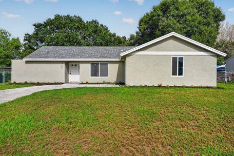 Photo of 302 SW Kentwood Road, Port Saint Lucie, FL 34953 (MLS # B26060486)