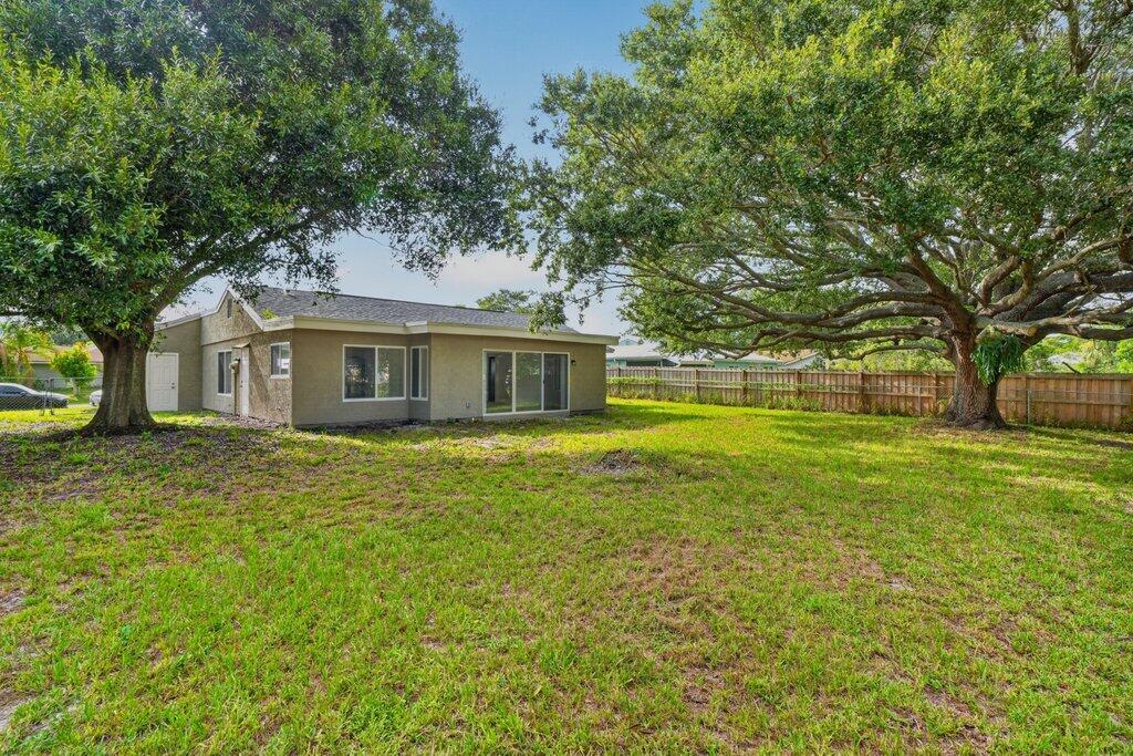Photo of 302 SW Kentwood Road, Port Saint Lucie, FL 34953 (MLS # B26060486)