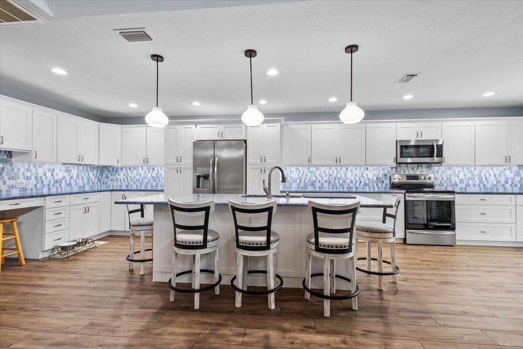 Photo of 959 NE Dahoon Terrace, Jensen Beach, FL 34957 (MLS # R11021861)