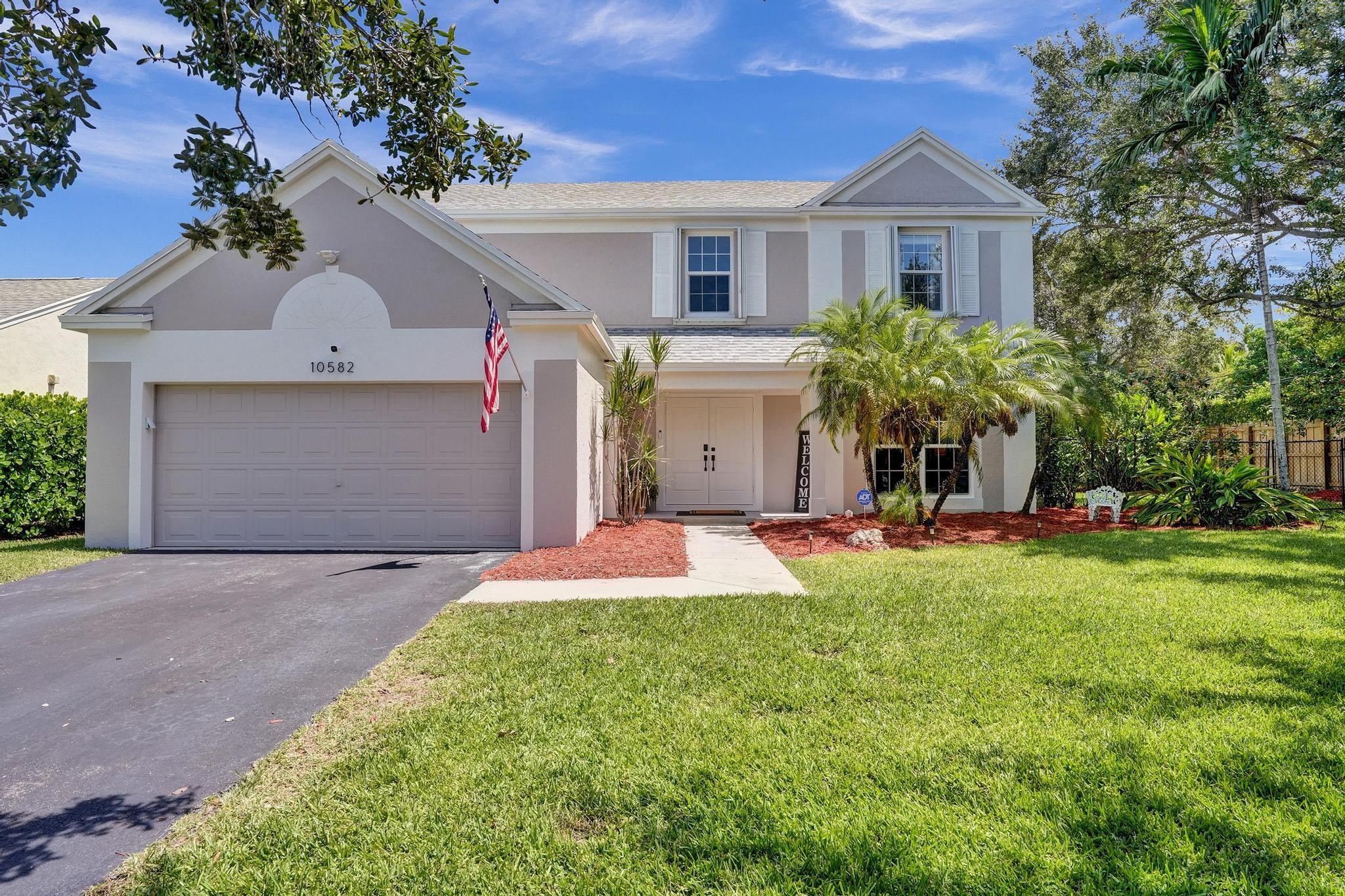 Start your day with lakefront coffee, end it with porch chats under swaying palms—welcome to Cooper’s Grove in Cooper City. This 4-bedroom, 2.5-bath gem sits on one of the neighborhood’s largest waterfront lots and is fully loaded: 2025 roof, impact windows and doors, and a smart security system. Inside, you’ll find soaring ceilings, a custom kitchen with real wood cabinetry, and updated baths that won’t need a thing. The layout flows easily for quiet nights or full-on family mode. Step outside to a screened porch, spacious patio, and front-row sunrise views. With A-rated schools, walkability to parks and shops, and an HOA that’s just $50/month, this home delivers the lifestyle—minus the to-do list. School’s about to start, so don’t blink. Someone else might beat you to it.