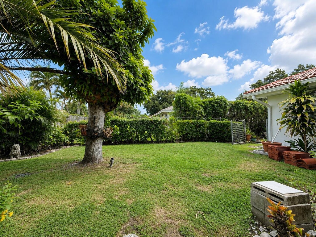 Photo of 10873 MAGNOLIA Street, Palm Beach Gardens, FL 33418 (MLS # B26073012)