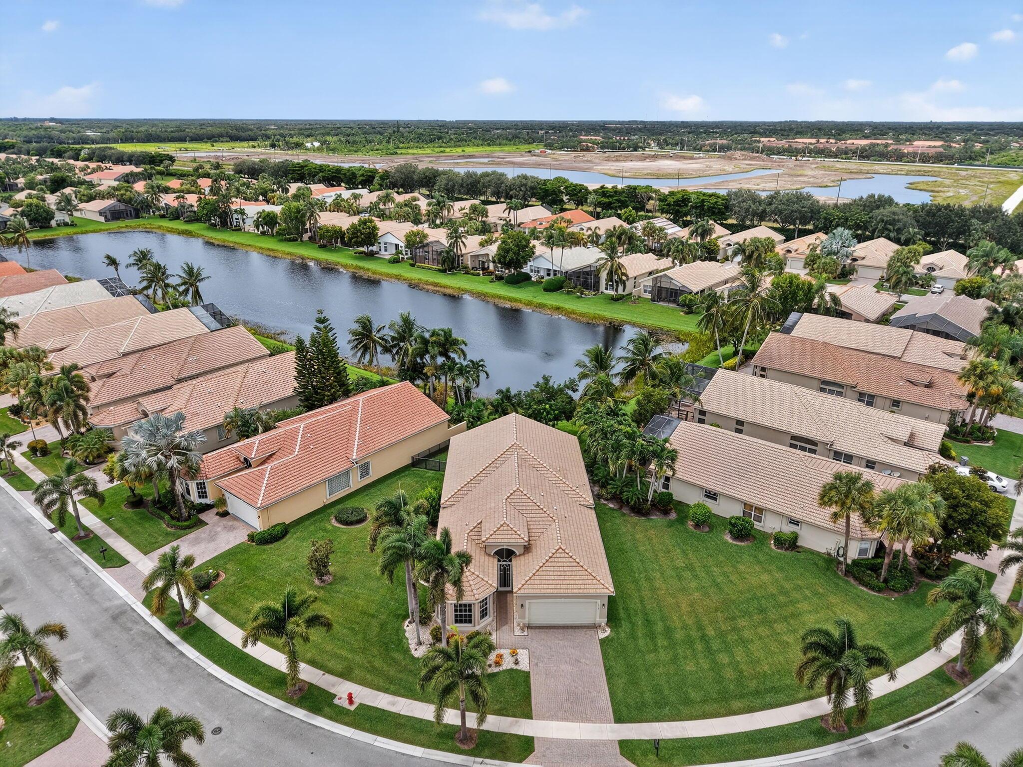Beautiful Lake Homesite oversized pie shaped Lot (9,621 sqft) Backyard is fenced adding protection to your private oasis perfect for your precious animal. Covered patio is screened in. Beautiful Laminate Floors adding natural beauty & timeless style. Classic & Elegant White Kitchen Cabinets enhanced by stunning granite counter tops. Magnificent Chandelier in Eat in Kitchen, garage has extra storage from the ceiling. Custom built-in closet in primary suite. Designer built-in furniture in den/4th bedrm. Buyer/buyers agent to verify information herein. Maintenance includes Free Internet, lawn common areas, exterior paint, alarm, SHO, HBO. Pickleball courts are being redone.
