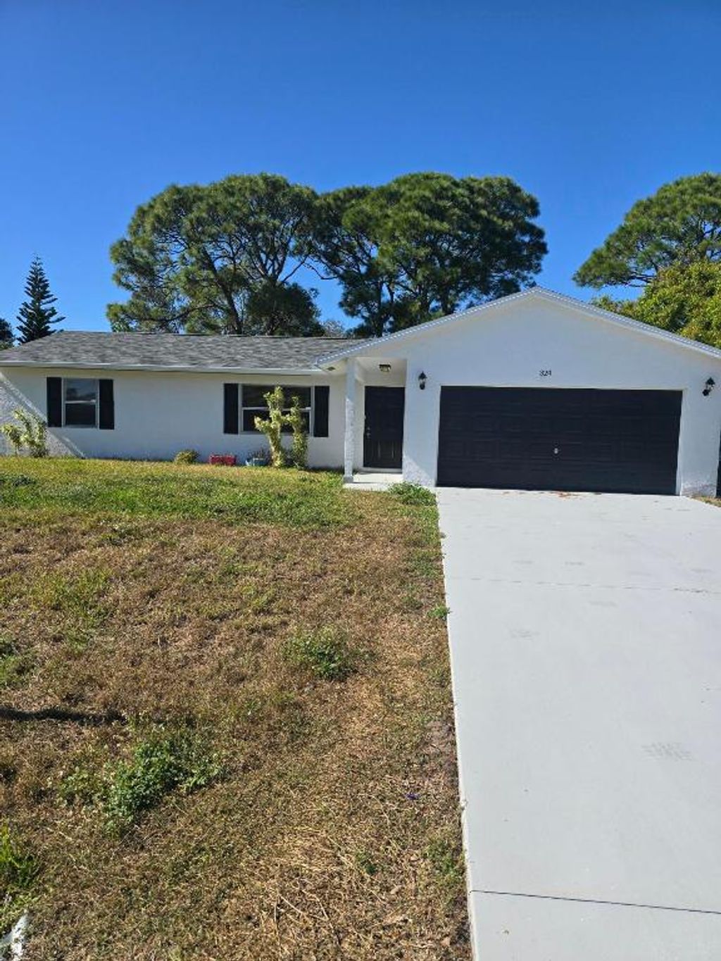 Photo of 324 NW Hogan Street, Port Saint Lucie, FL 34983 (MLS # R11137834)