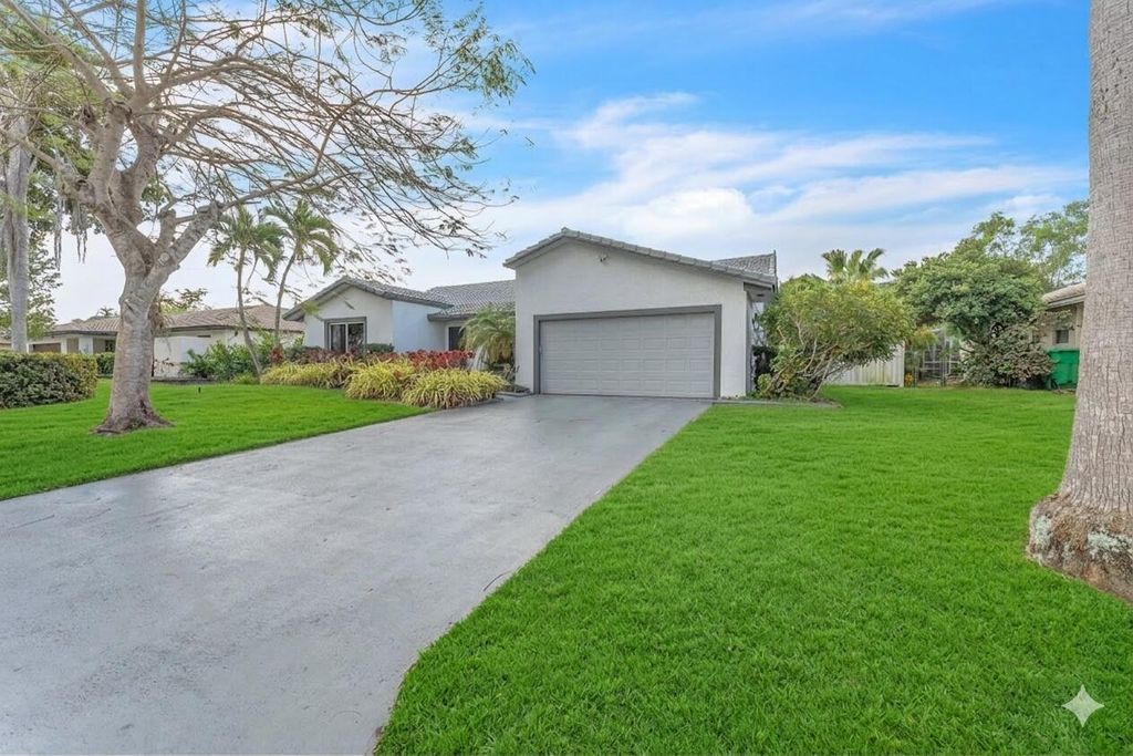 Photo of 10734 NW 20th Drive, Coral Springs, FL 33071 (MLS # B26003479)