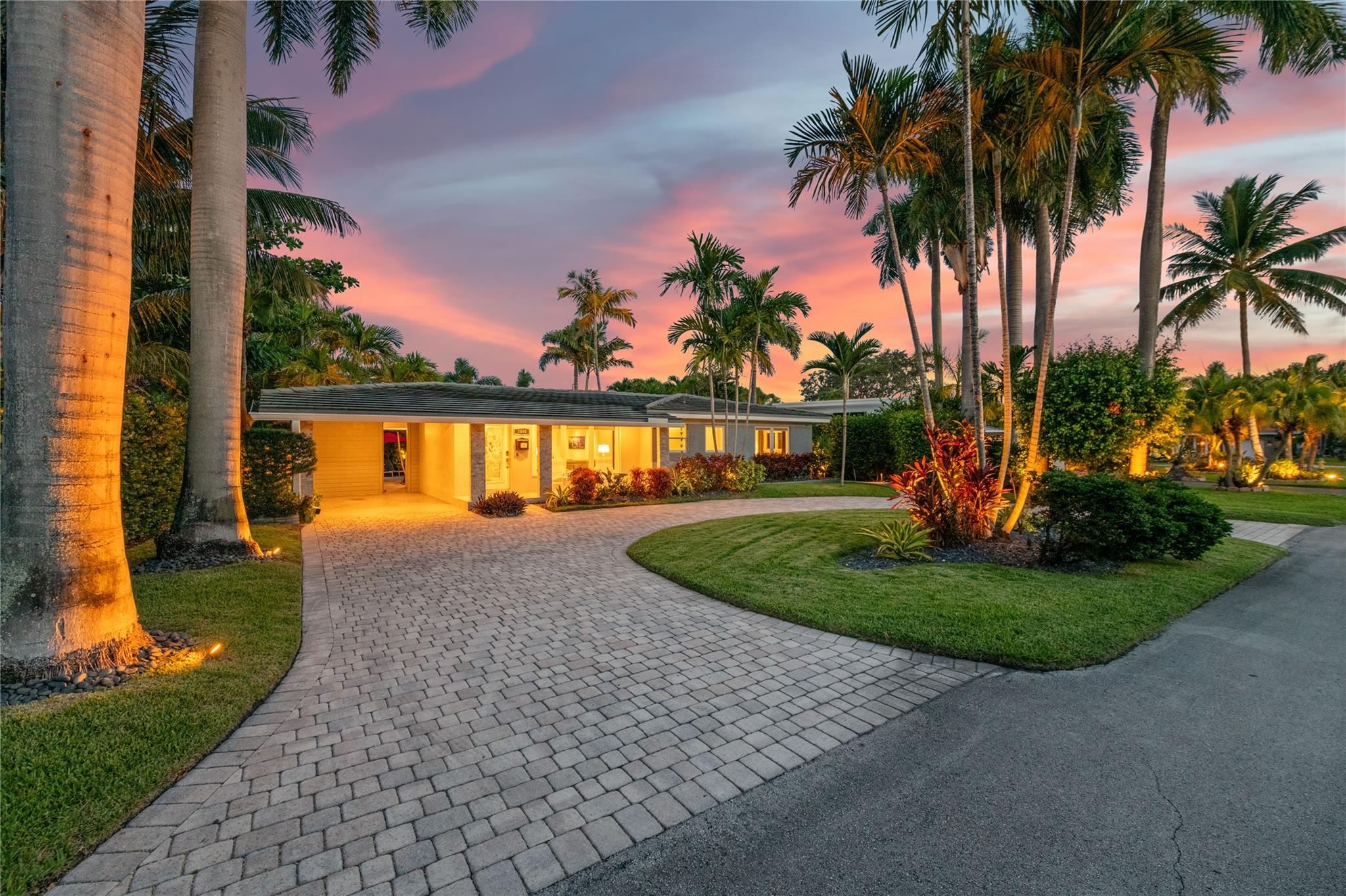 TROPICAL OASIS IN EAST WILTON MANORS! BEAUTIFULL MODERN RENOVATION, THIS 3 BED 2 AND 1/2 BATH WILL IMPRESS...HIGH GLOSS PORCELAIN FLOORS, WHITE LAQUER KITCHEN CABINETS TOPPED IN BLACK QUARTZ, CENTER ISLAND WITH STAINLESS FRONT AND DIAMOND FLECK QUARTZ WATERFALL COMFORTABLY SEATS 4, SS APPLIANCES, CUSTOM GLASS BACKSPLASH AND UNDER CABINET LIGHTING...THE HOME BOASTS ALL HURRICANE IMPACT WINDOWS AND DOORS...BATHROOMS ARE SLEEK AND MODERN WITH CUSTOM TILE AND HIGH END PLUMBING FIXTURES...SEPARATE FAMILY ROOM/DEN/OFFICE...STEP OUTSIDE TO A SPENDOR OF EXOTIC PLANTS AND PALM TREES ALL SURROUNDING A STUNNING HEATED POOL WITH BUILT-IN SPA, BRICK PAVER PATIO AND POOL DECK, THE BACK FEATURES A CHEF'S KITCHEN UNDER A PERGOLA FOR ENTERTAINING, PLUS AN AIR CONDITIONED CABANA 1/2 BATH AND LAUNDRY ROOM.