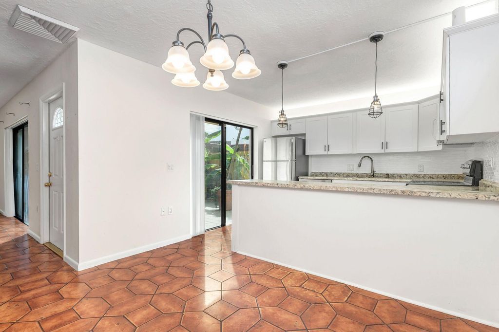 Photo of 620 6th Lane, Palm Beach Gardens, FL 33418 (MLS # R10940859)