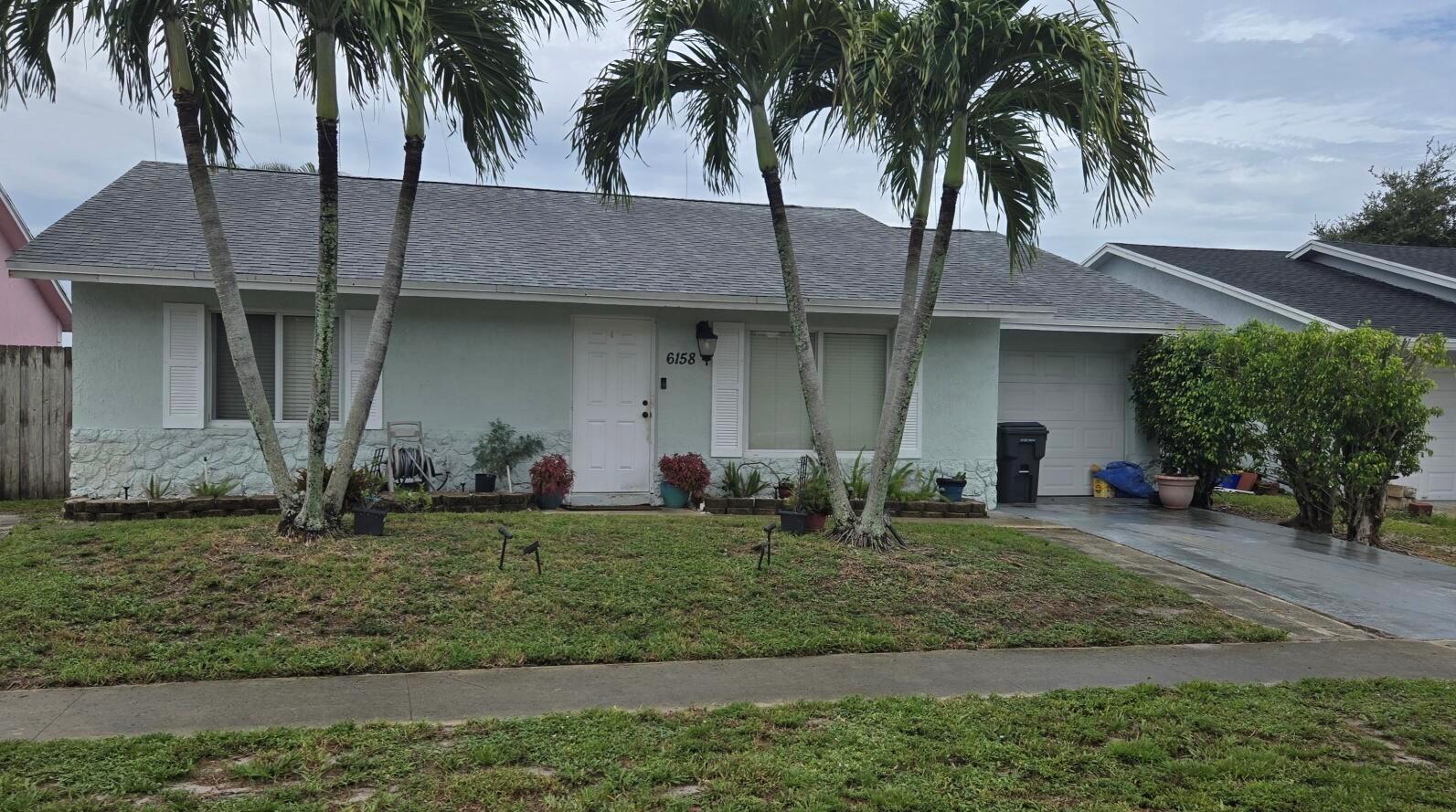 Wonderful single family home with three bedrooms, two full bath and a 1 car garage. Tile floors throughout, updated kitchen with granite countertops and stainless steel appliances. Large living and dining room full size washer and dryer. open patio with lake view. Impact windows and slider.Tenant occupied until October 1, 2025, please do not disturb tenant. Check with listing agent to make appointment to see.