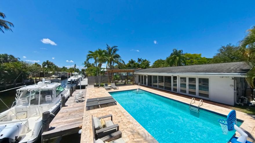 Welcome to Gill Isles! Updated 3-bed 2-bath home with additional Florida room - No Fixed Bridges - 65-foot seawall - new 40-foot dock, plus, an oversized heated saltwater pool. Step inside and you'll find a bright, open-concept layout with vaulted ceilings and abundant natural light. The modern kitchen features Samsung stainless steel appliances, quartz countertops, a breakfast nook, triple-door pantry, and custom cabinetry. Large porcelain tile floors, LED recessed lighting, and Insulated Ceilings. Equipped with impact windows and doors* Perfectly positioned in one of Fort Lauderdale's most desirable boating communities, just minutes from downtown, Las Olas, Brightline Train, and the Fort Lauderdale International Airport. *Florida room complete w/ Broward County approved​​‌​​​​‌​‌​​​‌‌​​​‌‌‌​​‌​​‌‌​​​​ shutters.